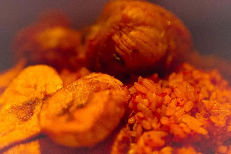 Fried plantain with jollof rice and chicken