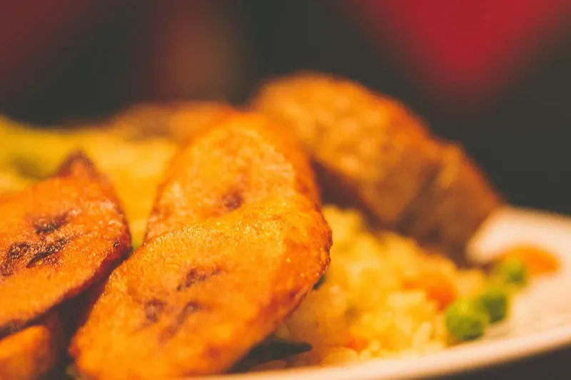 Fried plantain and fried rice close up