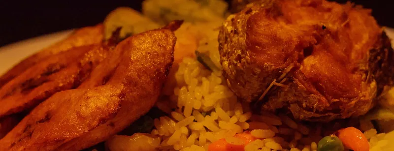 Fried chicken with fried rice and fried plantain